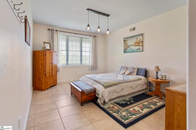 bedroom featuring light tile patterned floors