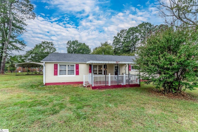 single story home featuring a front lawn, a carport, and covered porch