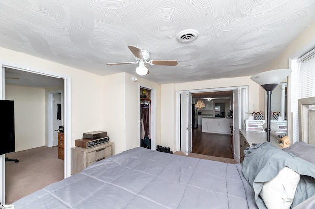 bedroom with ceiling fan, a closet, and light wood-type flooring