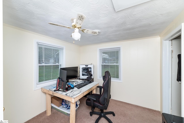 office space with carpet floors and ceiling fan