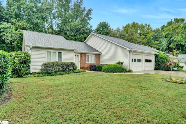 ranch-style home with a front yard and a garage