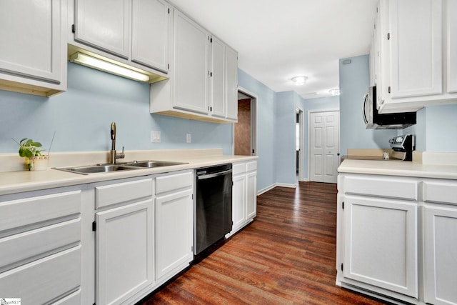 kitchen with sink, stainless steel dishwasher, range, white cabinetry, and dark hardwood / wood-style flooring