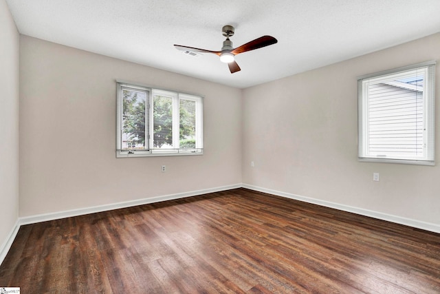 spare room featuring ceiling fan, a textured ceiling, and dark hardwood / wood-style floors