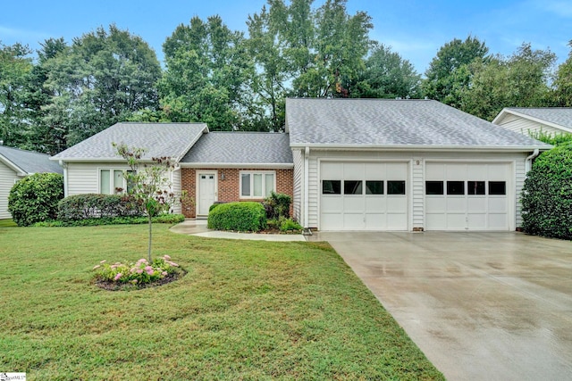 single story home with a garage and a front yard