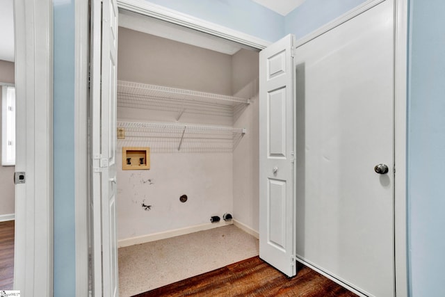 laundry room featuring washer hookup and dark hardwood / wood-style floors