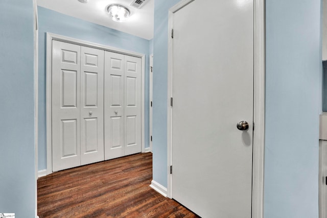 hall with dark hardwood / wood-style floors