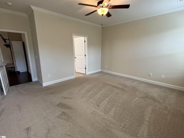 unfurnished bedroom with crown molding, light carpet, and ceiling fan