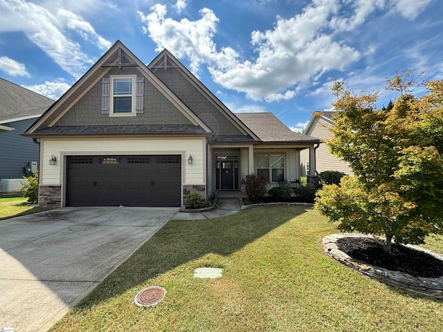 craftsman-style house featuring a front yard and a garage