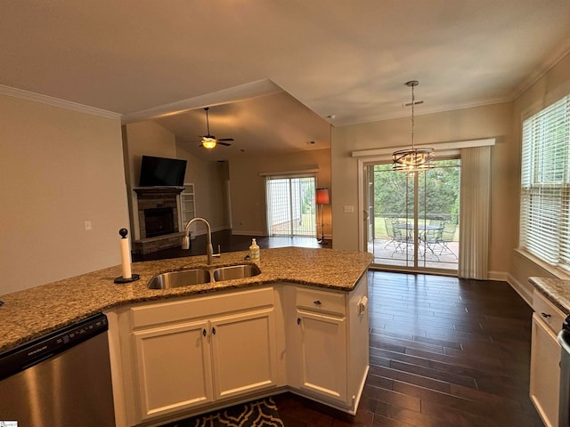 kitchen with ceiling fan with notable chandelier, dishwasher, white cabinetry, and sink