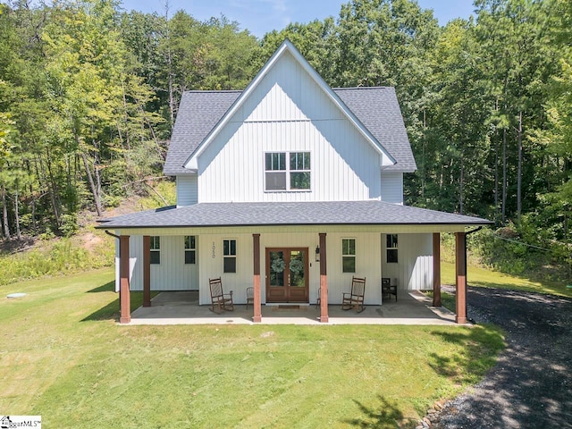 exterior space with a front yard and a porch