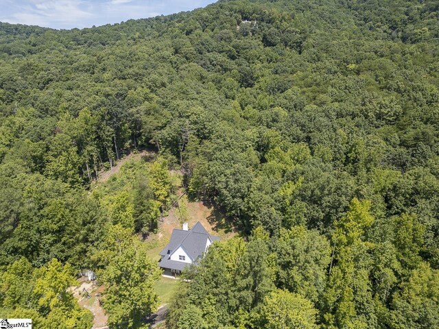 aerial view featuring a view of trees