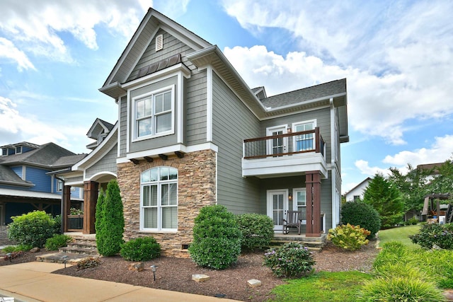 view of front of home with a balcony