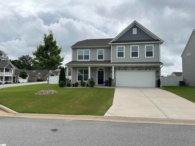 craftsman house featuring a front lawn and a garage