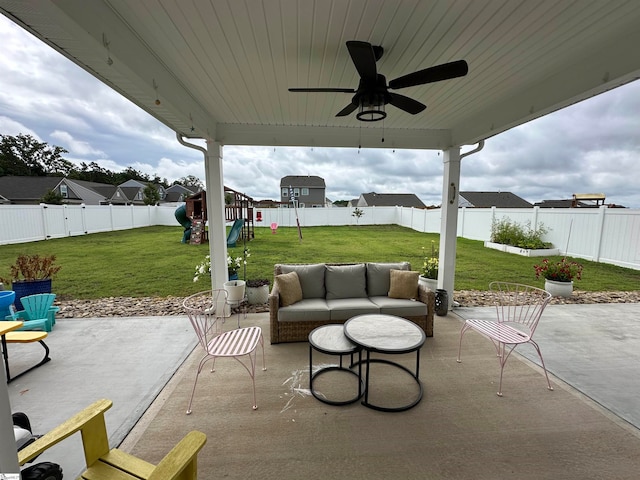 view of patio with ceiling fan and an outdoor living space