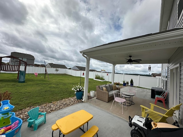 view of patio with an outdoor hangout area, ceiling fan, and a playground