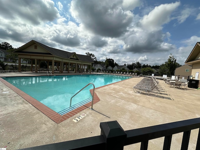 view of swimming pool featuring a patio