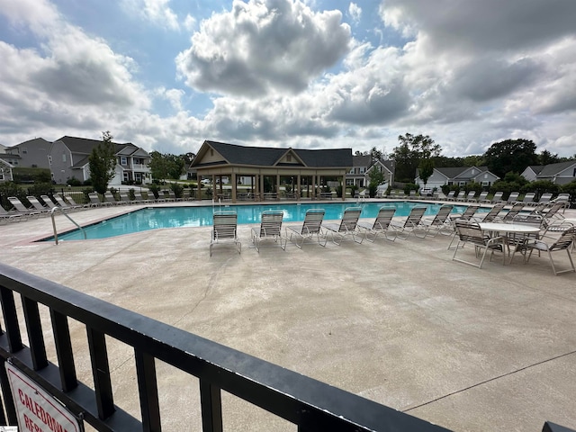 view of swimming pool with a patio