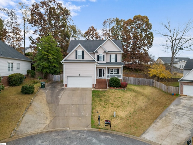 front of property featuring a front yard and a garage