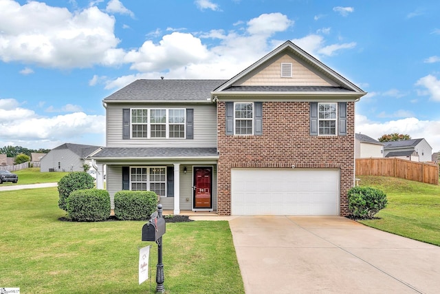 view of front of house with a front yard and a garage