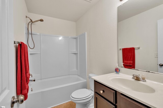 full bathroom with shower / tub combination, tile patterned flooring, vanity, and toilet