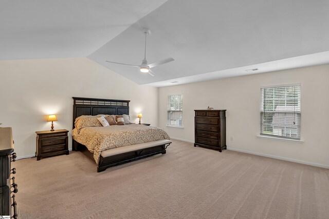 bedroom featuring light carpet, vaulted ceiling, and ceiling fan