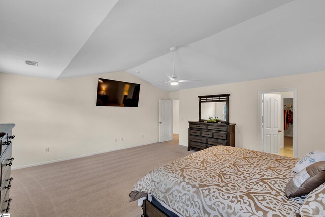 carpeted bedroom with vaulted ceiling and ceiling fan