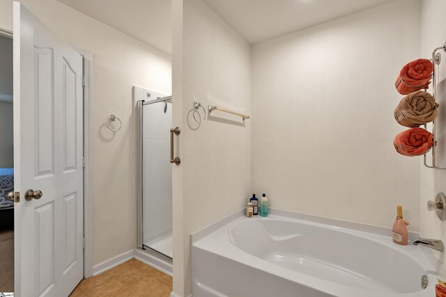 bathroom with plus walk in shower and tile patterned floors