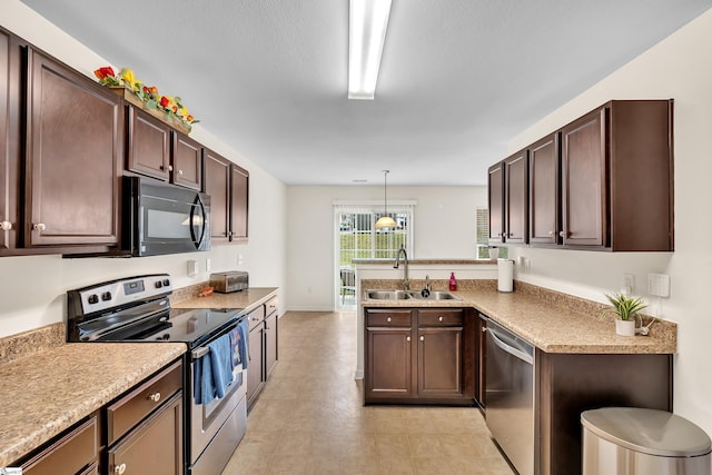 kitchen with kitchen peninsula, stainless steel appliances, dark brown cabinets, decorative light fixtures, and sink