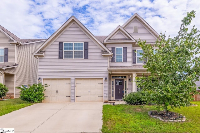 view of front of property featuring a garage and a front lawn