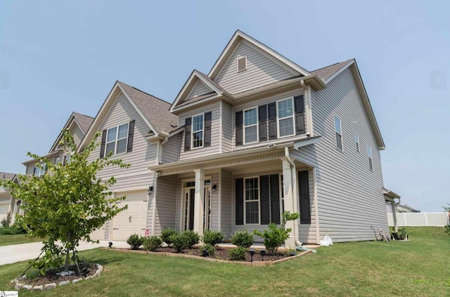 craftsman house featuring a front lawn, a garage, and covered porch