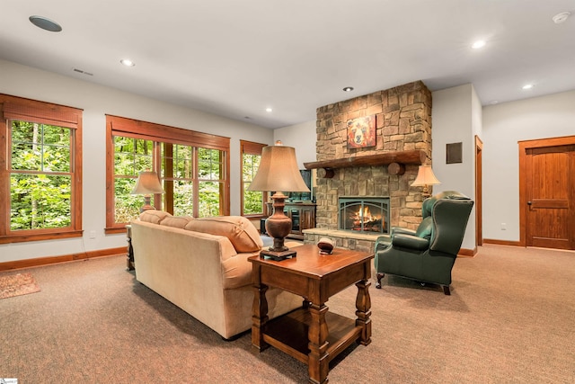 living room with carpet, a fireplace, and plenty of natural light