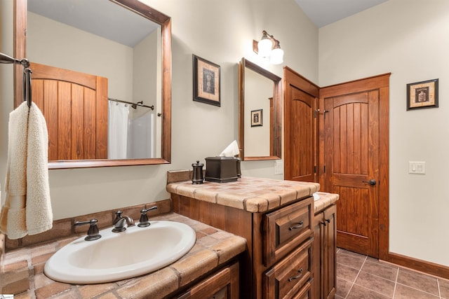 bathroom featuring vanity and tile patterned flooring