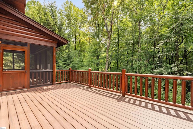 wooden deck featuring a sunroom