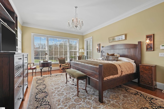 bedroom with hardwood / wood-style flooring, crown molding, and a notable chandelier