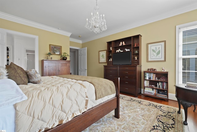 bedroom featuring an inviting chandelier, crown molding, and hardwood / wood-style floors