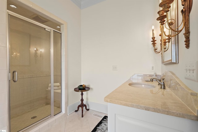 bathroom with vanity, tile patterned flooring, and a shower with door