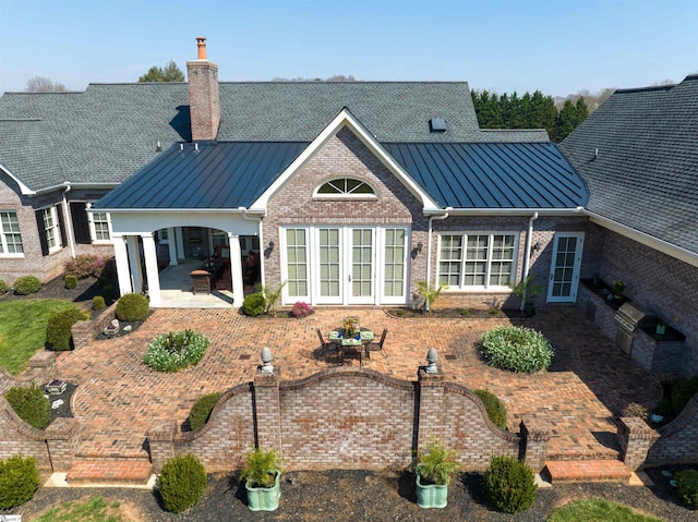 rear view of house featuring a patio area