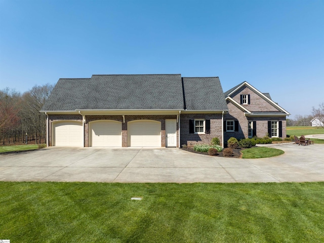 view of front facade with a garage and a front yard