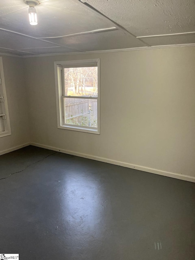 spare room with concrete flooring