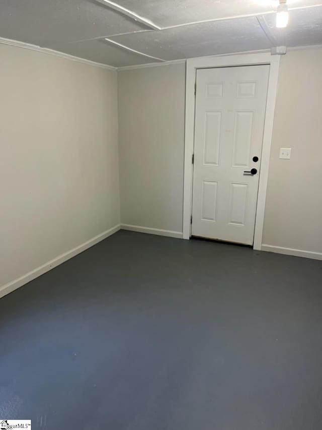 unfurnished room with concrete floors