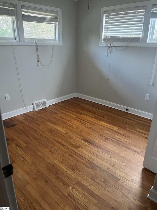 empty room featuring hardwood / wood-style flooring