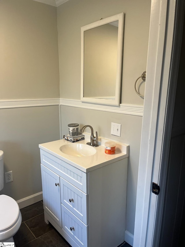 bathroom with vanity, toilet, and tile patterned flooring