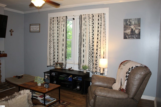 living room featuring ceiling fan, dark hardwood / wood-style floors, ornamental molding, and a healthy amount of sunlight