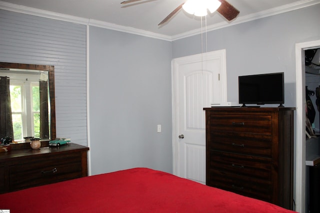 bedroom featuring ceiling fan and ornamental molding