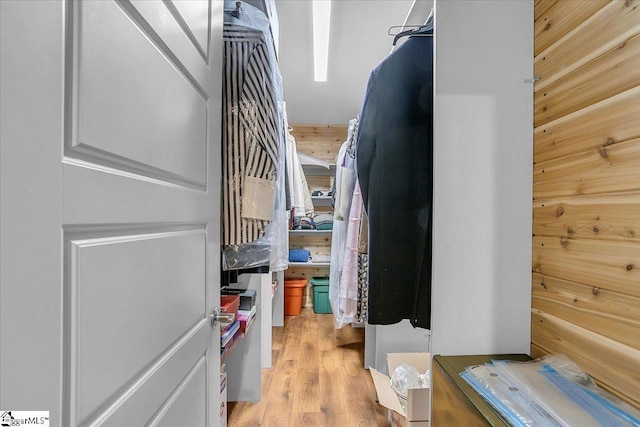 spacious closet with light hardwood / wood-style flooring