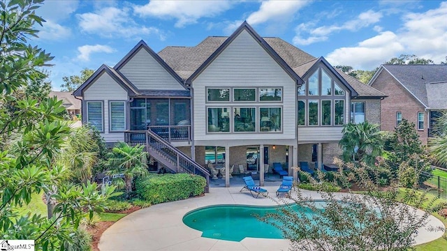 rear view of property featuring a patio