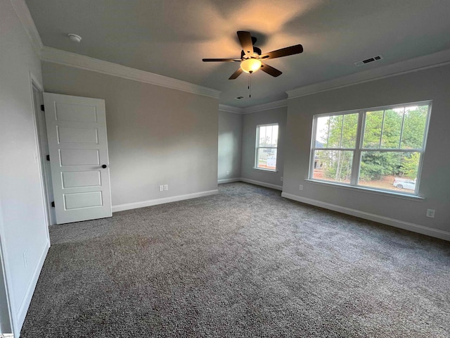 carpeted spare room with crown molding and ceiling fan