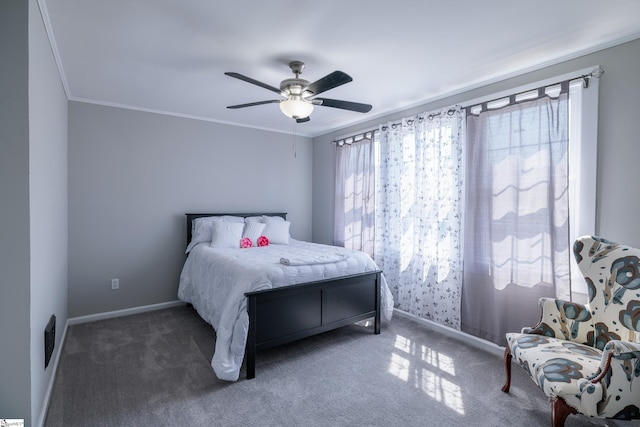 carpeted bedroom featuring crown molding and ceiling fan