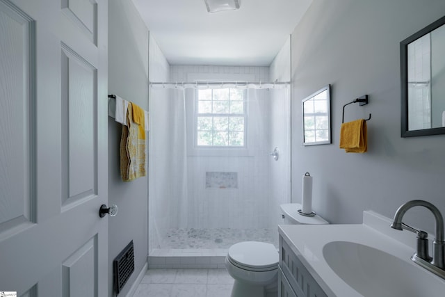 bathroom featuring walk in shower, vanity, and toilet