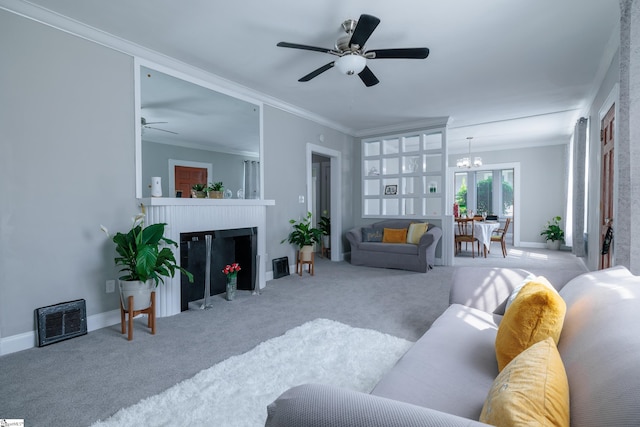 carpeted living room featuring ceiling fan, french doors, and ornamental molding